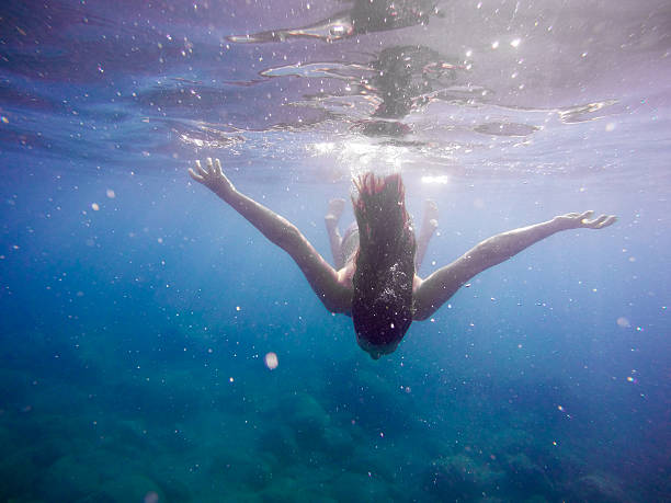 istock Girl enjoying underwater 518381860