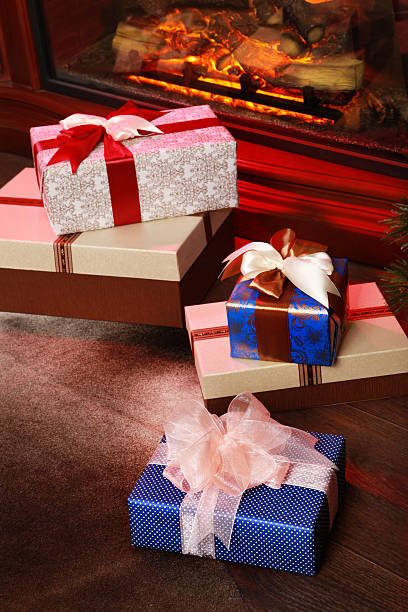 istock Christmas gifts near fireplace 518382183