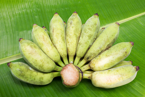 Banana, Cultivated Banana on banana leaf background.