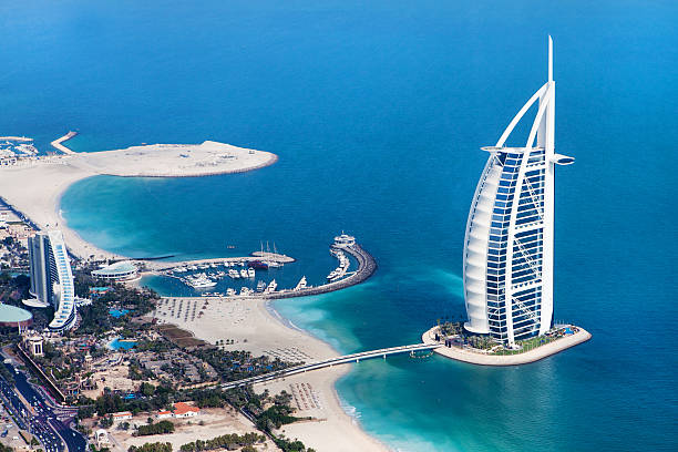 Dubai, UAE. Burj Al Arab from above Dubai, United Arab Emirates - January 20, 2011: Burj Al Arab, a luxury 5 star hotel built on an artificial island in front of Jumeirah beach from above dubai island stock pictures, royalty-free photos & images