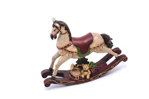 A small rocking horse on a white background