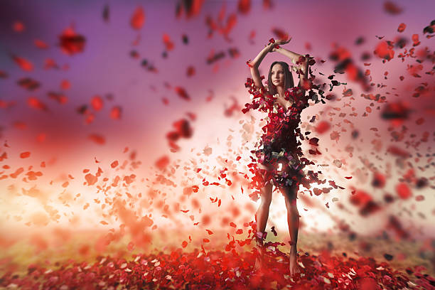 istock young woman and rose petals 518382564