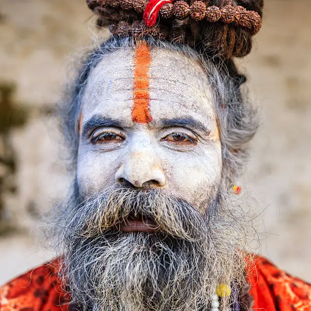 This Sadhu uses ashes of cremated remains to prepare specific white color of his makeup.
