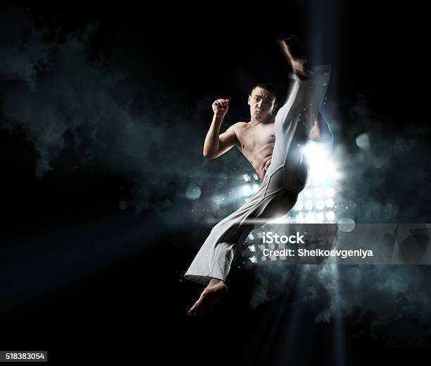 Combative Sport Male Fighter Trains Capoeira Stock Photo - Download Image Now - Wushu, Capoeira, Dancer