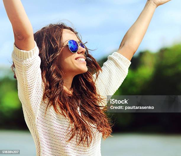 Attractive Happy Woman In Sunglasses Enjoying Freedom Outdoors Stock Photo - Download Image Now