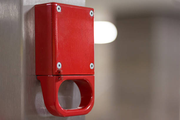 istock blank red emergency brake mock-up in metro station. 518395532
