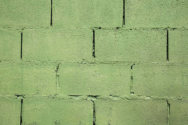 istock Old cement blocks wall imitation brick wall painted green color 518400534
