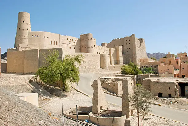 Nizwa Bahla Fort in Ad Dakhiliya, Oman. It was built in the 13th and 14th centuries. It has led to its designation as a UNESCO World Heritage Site in 1987.