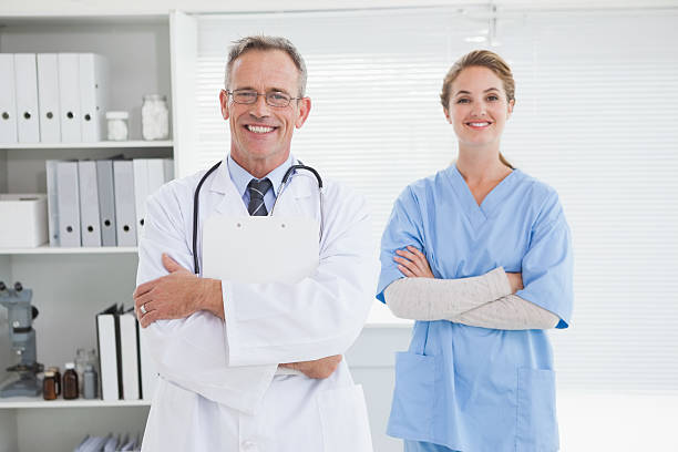 istock Smiling doctor with fellow co worker 518401227