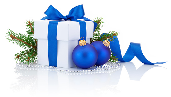White box tied blue ribbon bow, pine tree branch and two christmas balls Isolated on white background