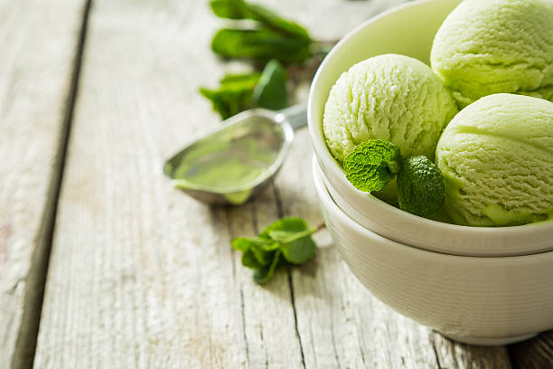 istock Pictachio ice cream in white bowl 518408066