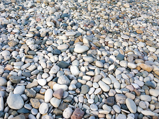 istock Pebble stones on coastline 518408940