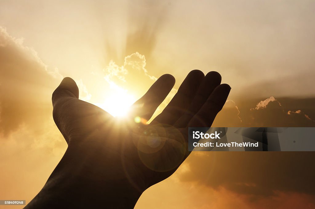 Hand on sunset background Hand on sunset background success, peace,freedom concept God Stock Photo