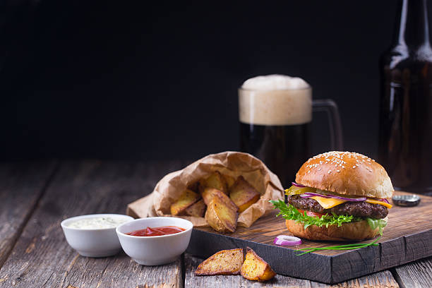 istock Burger with cold beer and fries 518410046