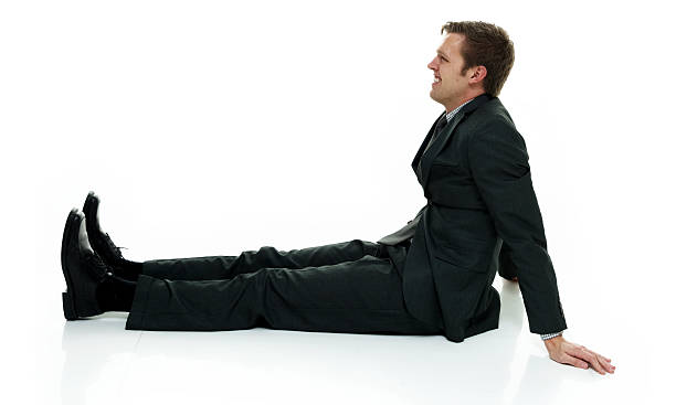 istock Smiling businessman sitting and looking away 518411898