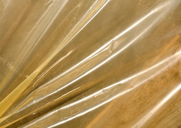 istock Yellow plastic film texture in sunlight. 518413698