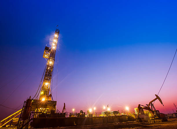 istock oilfield derrick at night 518413908