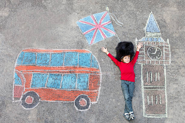 istock kid boy in british soldier uniform with London chalks picture 518413972