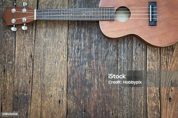 On Old Wooden Background Dark Tone Stock Photo - Now - Ukulele, Brown, Cultures iStock