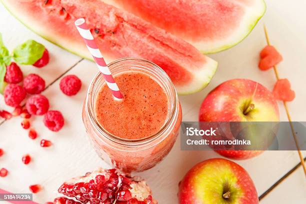 Organic Red Smoothie With Apple Watermelon Pomegranate Raspbe Stock Photo - Download Image Now