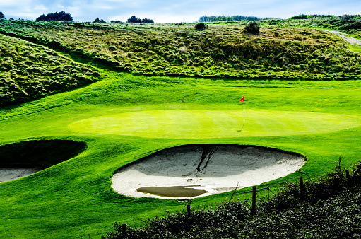 One green golf field in the countryside