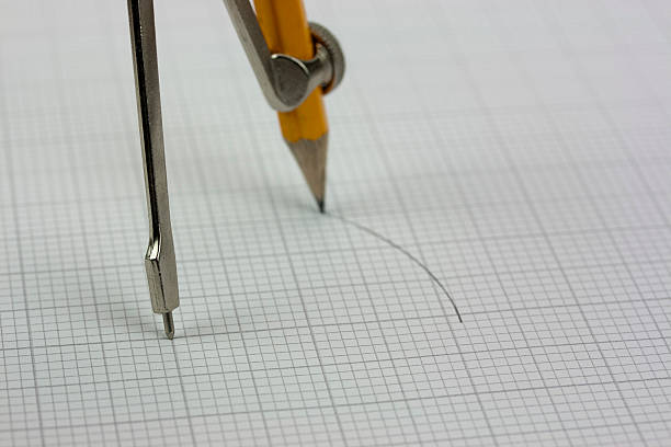 istock Close up of a compass on graph paper 518424026