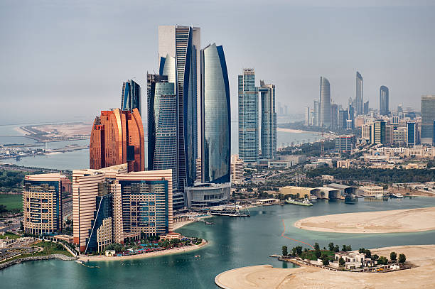 National landmarks Helicopter point of view of Abu Dhabi skyline with surrounding area. aircraft point of view stock pictures, royalty-free photos & images