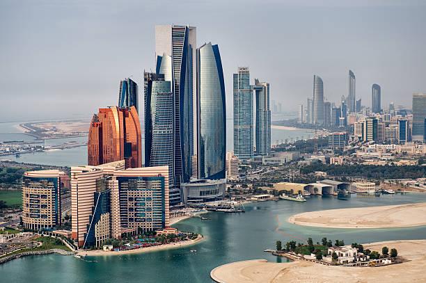 National landmarks Helicopter point of view of Abu Dhabi skyline with surrounding area. minaret stock pictures, royalty-free photos & images