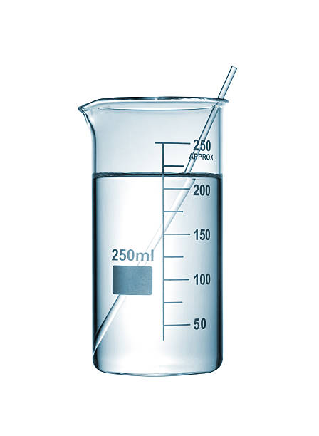 istock Chemical beaker with a solution and stirring rod on white 518425635
