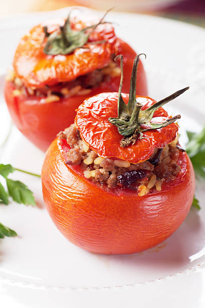 gefüllte tomate - stuffed tomato stock-fotos und bilder