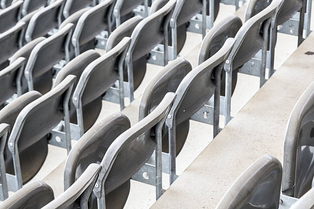 istock some rows of gray stadium seats, shoot from behind 518427903