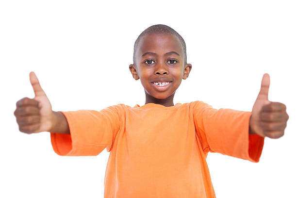 istock Cute boy showing thumbs up 518428567