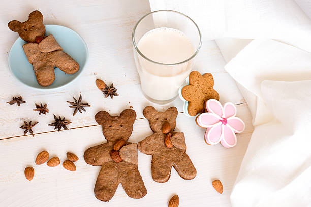 istock Teddy bear shaped cookies with almond and milk 518428590