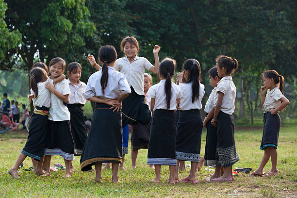 young unidentified girls playing in school stock photo