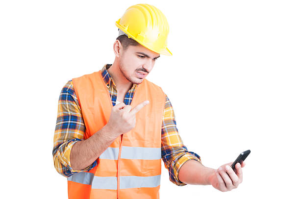 istock Rudeness and obscene gesture concept with young engineer or cons 518429290