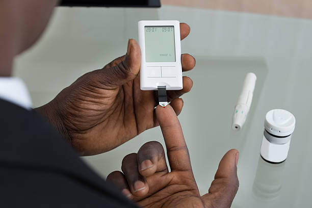 Patient Hands With Glucometer Close-up Of Patient Hands Measuring Glucose Level Blood Test With Glucometer glucose photos stock pictures, royalty-free photos & images