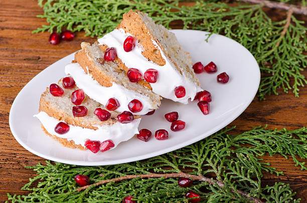 istock Pieces of cake decorated with icing and a pomegranate 518432542