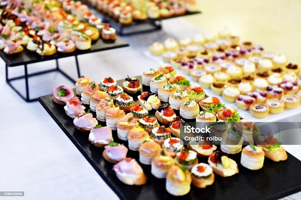 Appetizers on plates ready for eat Catering food shot with small appetizers on plates ready for eat Caterer Stock Photo