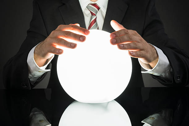 istock Businessman Predicting Future With Crystal Ball 518433454