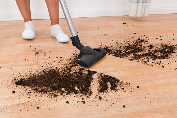 istock Person With Vacuum Cleaner Cleaning Floor 518437182