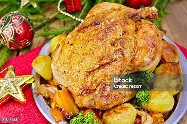 Chicken With Red Christmas Toys On Board Stock Photo - Download Image Now - Apple - Fruit, Baked, Branch - Plant Part