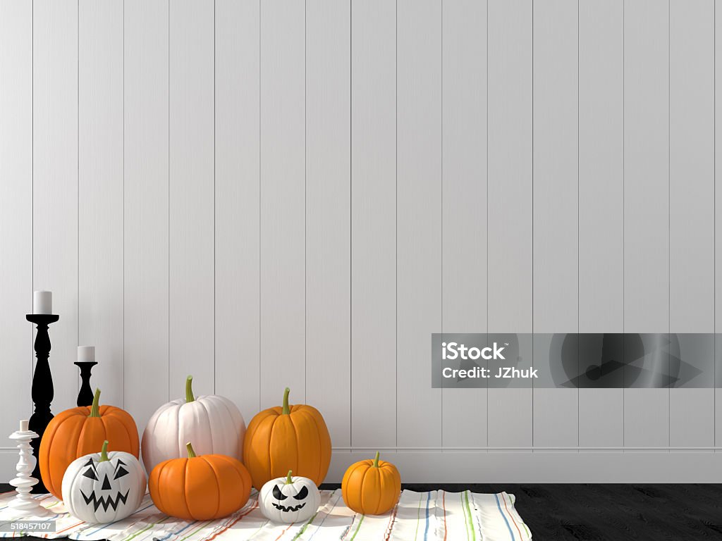 Funny pumpkin against a white wall Decorations for Halloween against the wall of white boards Halloween Stock Photo