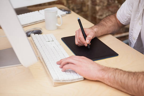 istock Artist drawing something on graphic tablet 518457257