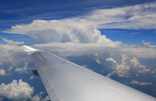 Aircraft wing on the clouds, flying background Croatia