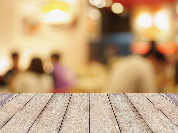 istock Perspective wood with blurred cafe bokeh light background 518458490