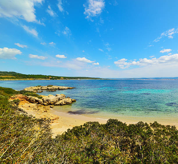istock small cove under a blear sky in Sardinia 518459100