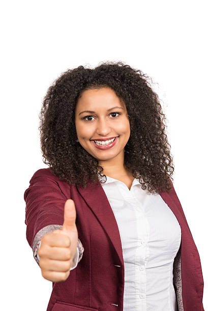 istock Smiling woman shows thumb up 518459252