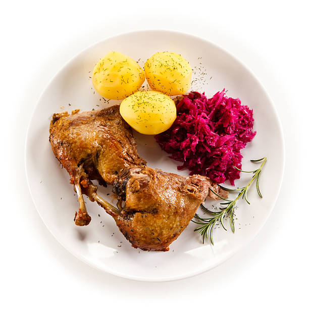 istock Roast duck thighs, boiled potatoes and red cabbage 518459864