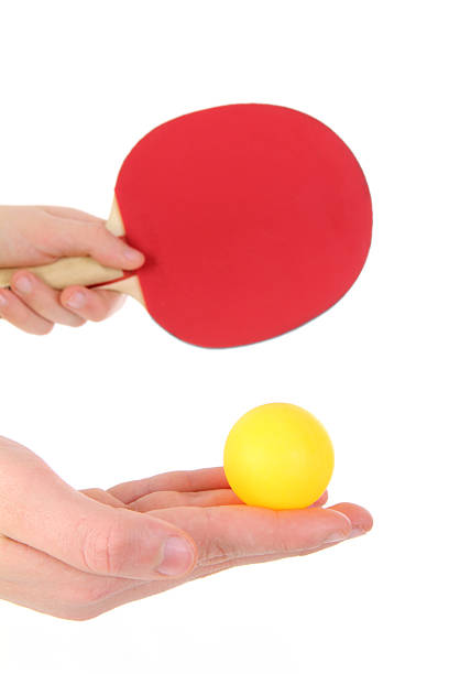 istock Table tennis racket with orange ball 518460654