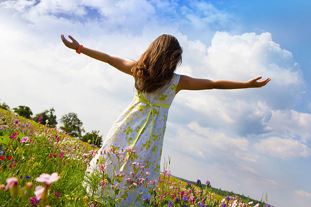 istock Relaxing in field of flowers 518460700
